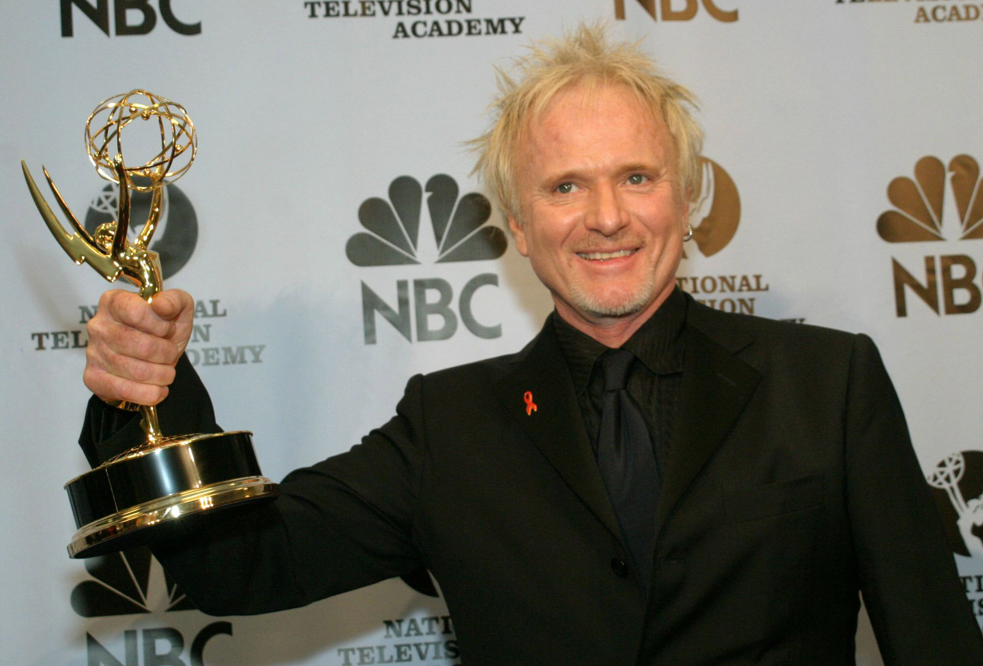 FILE - Anthony Geary holds up his Emmy as poses for photographers after winning "Outstanding Lead Actor In A Drama Series" at the 31st Annual Daytime Emmy Awards in New York, May 21, 2004.(AP Photo/ Tina Fineberg, File)