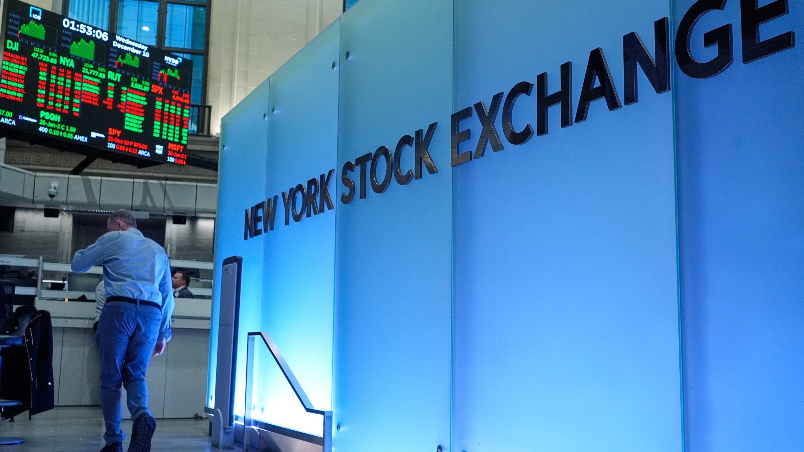 Traders work on the floor at the New York Stock Exchange in New York, Wednesday, Dec. 10, 2025. (AP Photo/Seth Wenig)