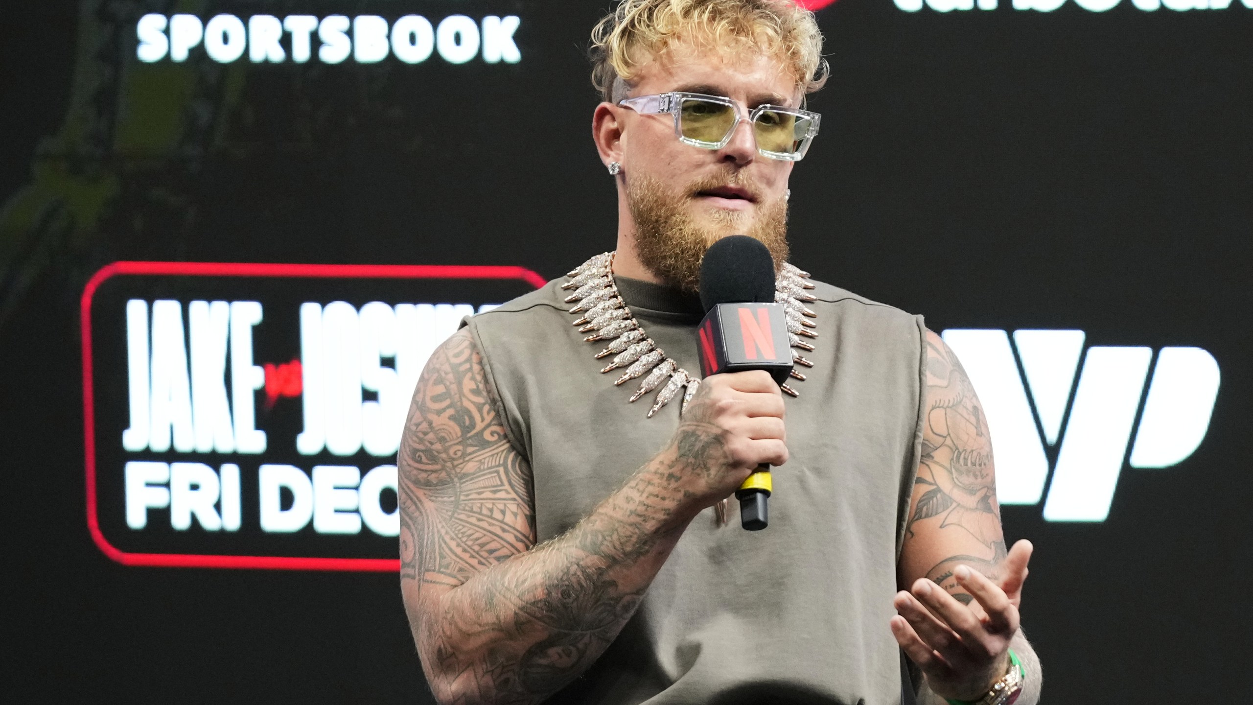 Jake Paul speaks during a news conference with Anthony Joshua promoting their upcoming heavyweight boxing match, Friday, Nov. 21, 2025, in Miami. (AP Photo/Lynne Sladky)