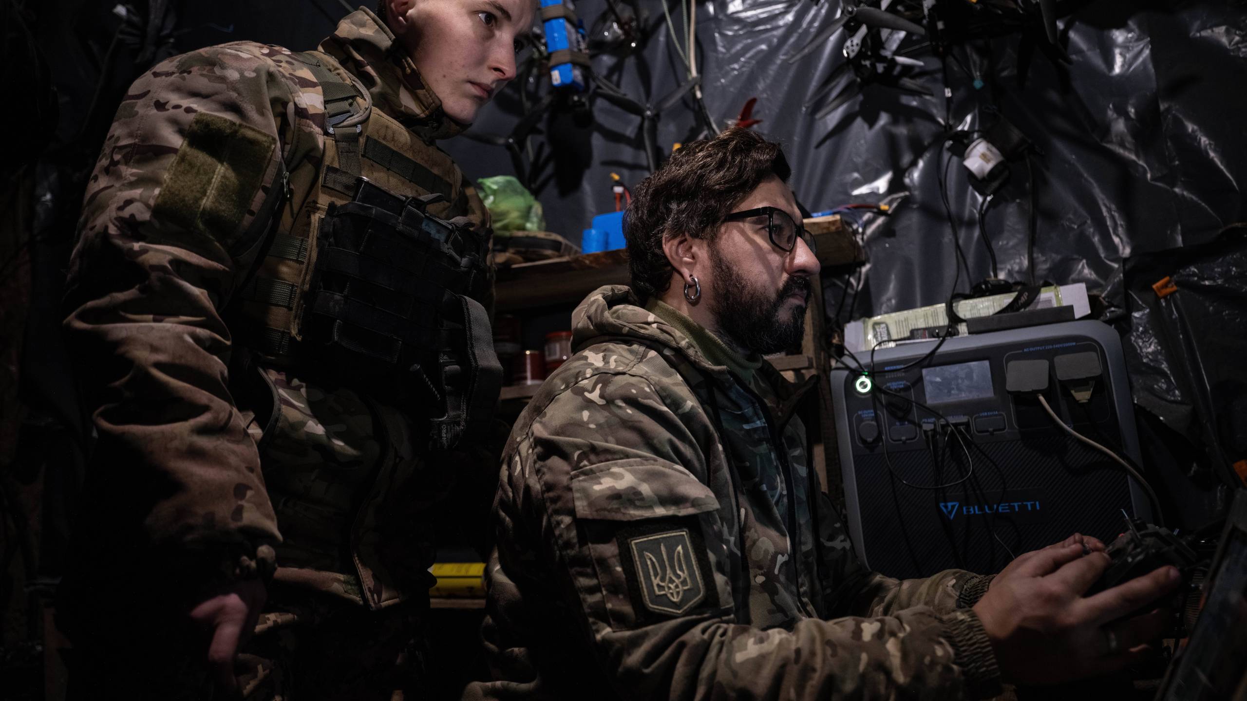 In this photo, taken Tuesday, Dec. 16, 2025 and provided by Ukraine's 93rd Kholodnyi Yar Separate Mechanized Brigade press service, soldiers control an FPV drone to fire towards Russian positions in a shelter in Kostyantynivka direction, Donetsk region, Ukraine. (Iryna Rybakova/Ukraine's 93rd Mechanized Brigade via AP)
