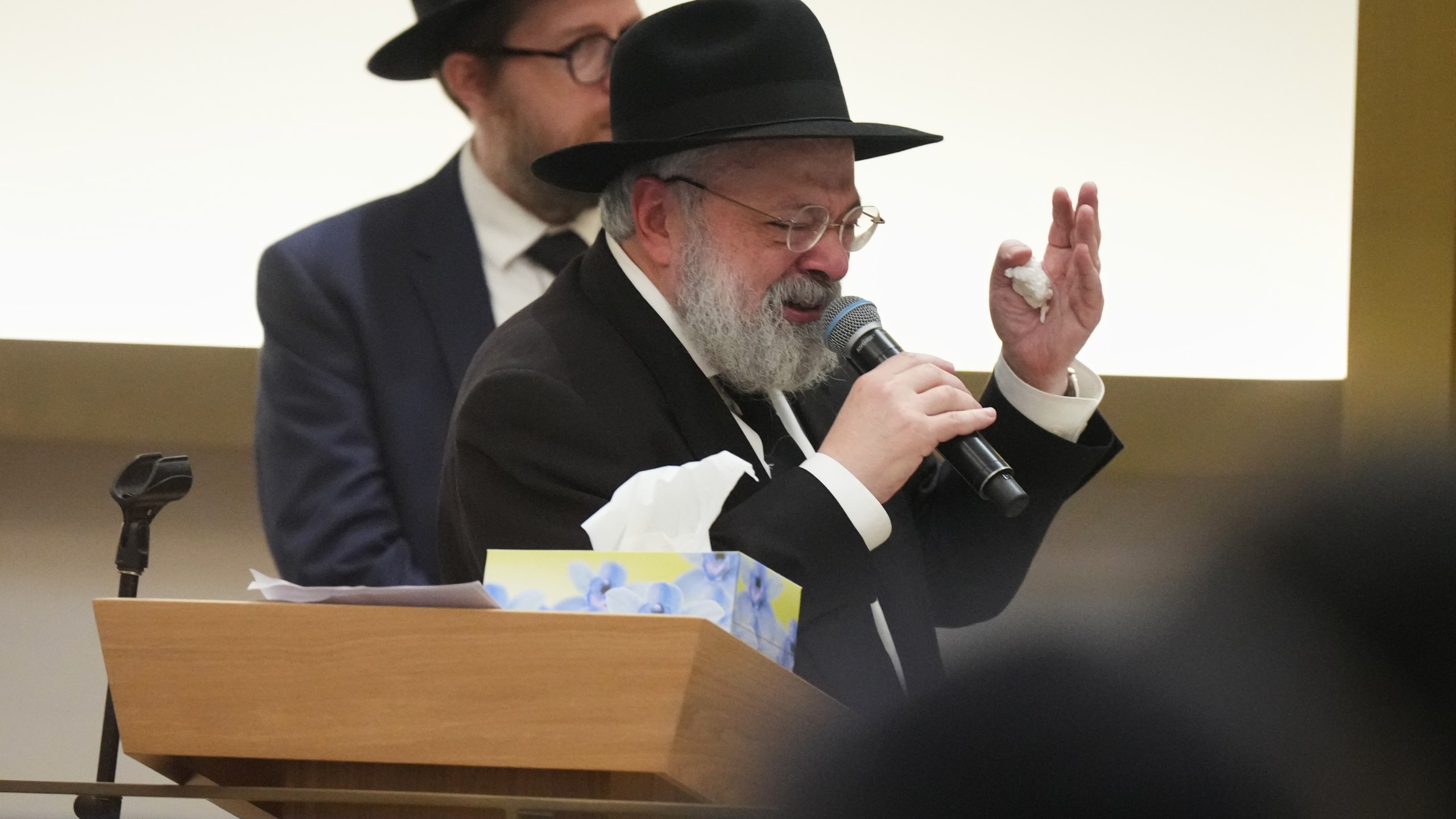 Rabbi Yehoram Ulman, father-in-law of Rabbi Eli Schlanger, a victim in the Bondi Beach mass shooting, speaks at his funeral at a synagogue in Bondi on Wednesday, Dec. 17, 2025, in Sydney, Australia. (AP Photo/Mark Baker, Pool)