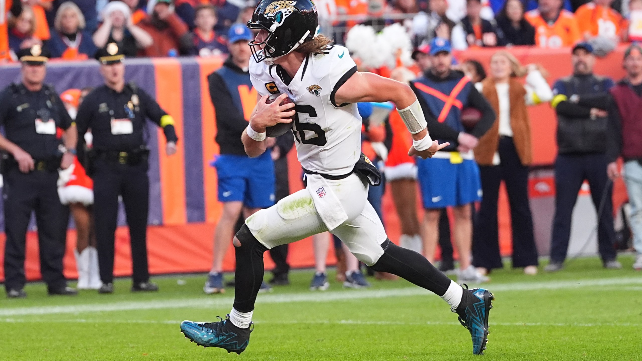 Jacksonville Jaguars quarterback Trevor Lawrence runs for a touchdown against the Denver Broncos during the second half of an NFL football game in Denver, Sunday, Dec. 21, 2025. (AP Photo/David Zalubowski)