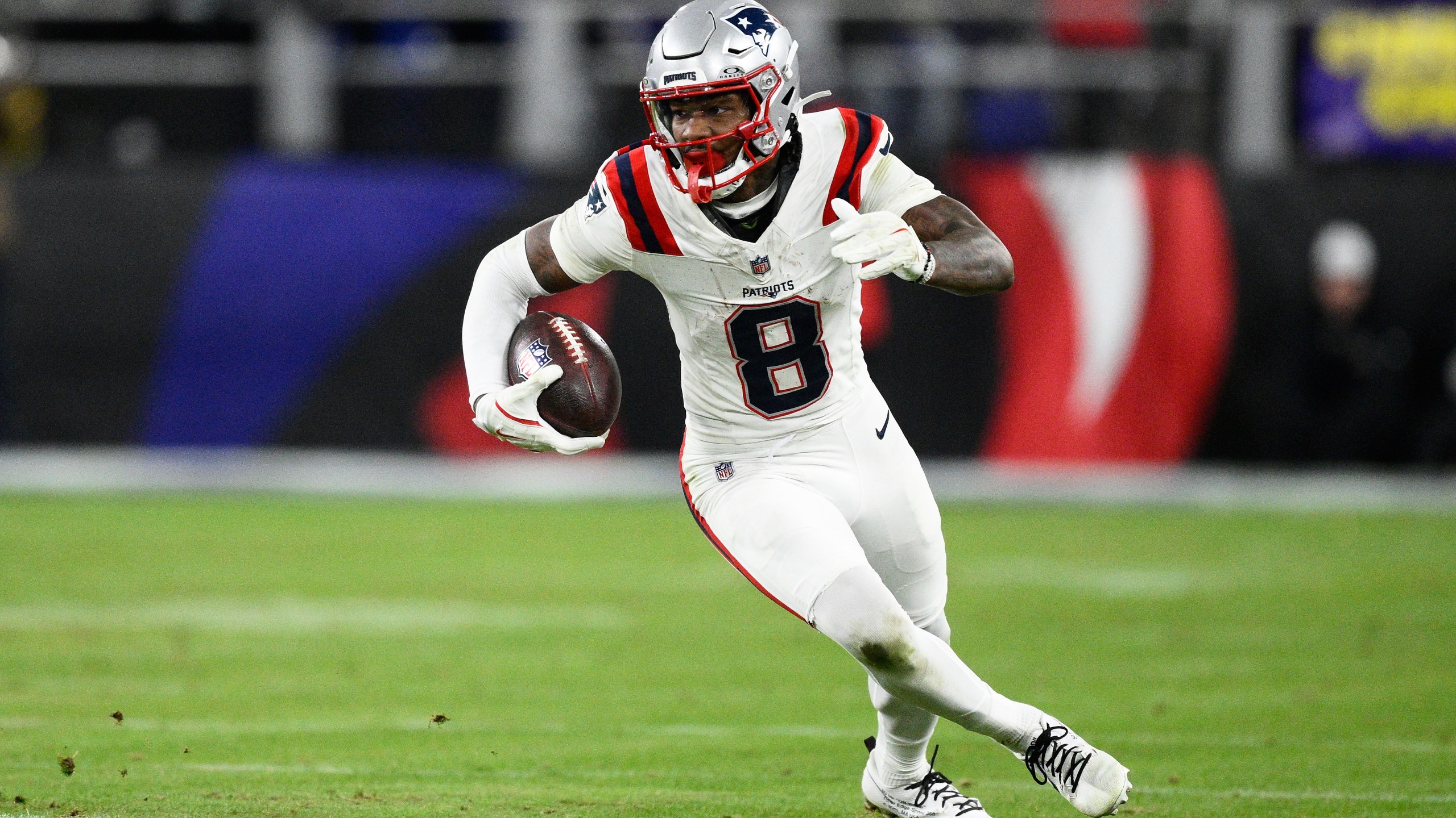 New England Patriots wide receiver Stefon Diggs (8) runs against the Baltimore Ravens during the second half of an NFL football game, Sunday, Dec. 21, 2025, in Baltimore. (AP Photo/Nick Wass)
